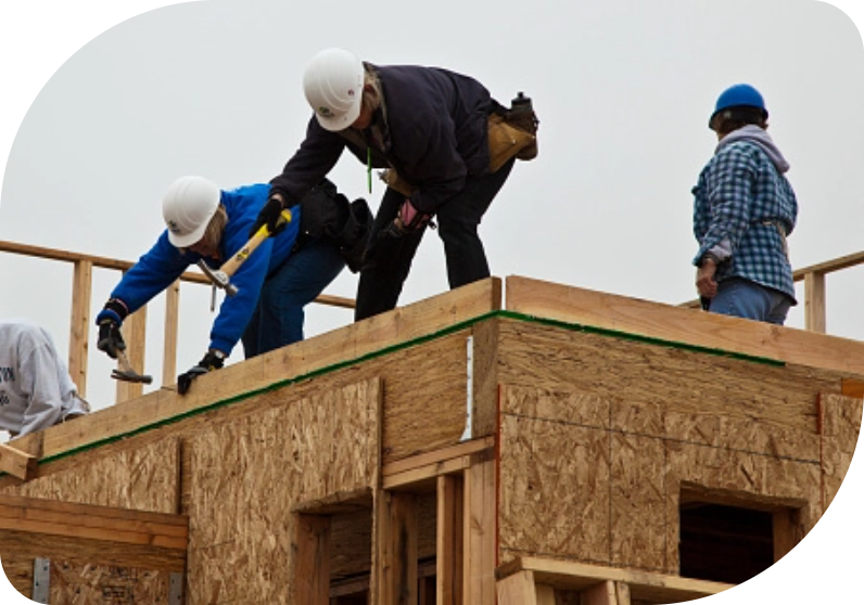 Construction workers framing a building