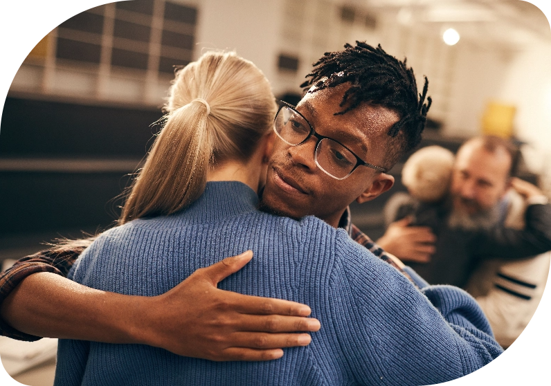 Two people hugging